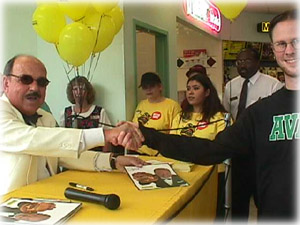 Gene has a burger in his palm!  Watch out!